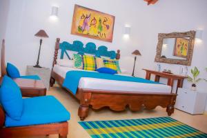 Cama ou camas em um quarto em Kurumba Villas