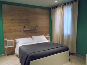 A bed or beds in a room at B&B Casazze Dream