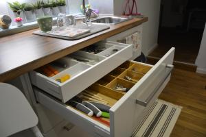 a kitchen with a sink and a drawer at Apartment EMA in Ljubljana
