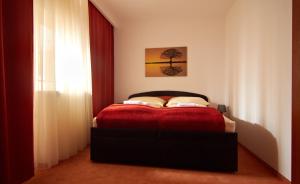 A bed or beds in a room at Penzión Donet