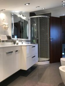 a bathroom with two sinks and a shower at Puntižela-Patty in Pula +93 photos