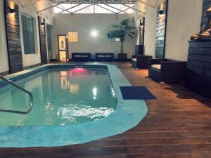 a pool in a building with a pool at Hotel Select in Piriápolis