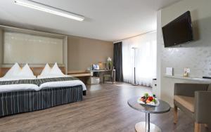 Katil atau katil-katil dalam bilik di Hotel Olten Swiss Quality