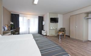 Katil atau katil-katil dalam bilik di Hotel Olten Swiss Quality
