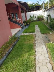 a walkway in front of a house at Flat - Coroa Vermelha in Santa Cruz Cabrália