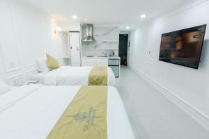 Postel nebo postele na pokoji v ubytování Gladsheim Hotel