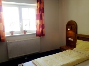 Un pat sau paturi într-o cameră la Salzingerhof