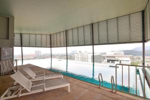 a room with a view of a body of water at Mercure Selangor Selayang in Batu Caves
