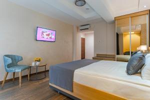 Rubicon Garni Hotel客房内的一张或多张床位