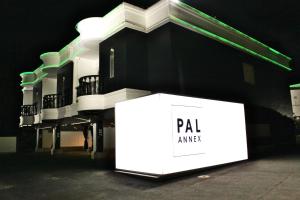 a box sitting in front of a building at night at Pal Annex Munakata (Love Hotel) in Munakata