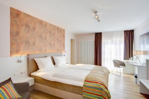 
Ein Bett oder Betten in einem Zimmer der Unterkunft Elisabeth Hotel garni

