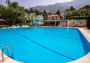 a large blue swimming pool in a resort at Hotel Greenland - All Inclusive in Oludeniz