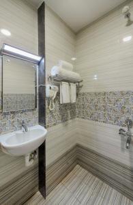 Koupelna v ubytování Hotel Ramraj Regency
