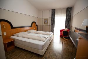 Postel nebo postele na pokoji v ubytování Hotel Fuchspalast