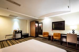 Postel nebo postele na pokoji v ubytování Yoyo Hotel