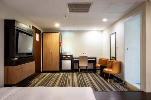Postel nebo postele na pokoji v ubytování Yoyo Hotel
