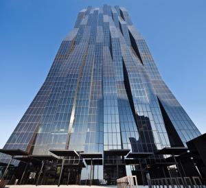 a tall glass building with a blue sky in the background at Melia Vienna in Vienna