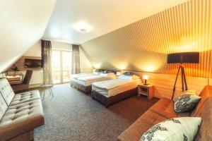 Posteľ alebo postele v izbe v ubytovaní Hotel Zakopane Wellness & SPA ex Korona Tatr