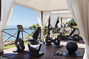 a room with a bunch of gym equipment in a tent at Palazzo Avino in Ravello