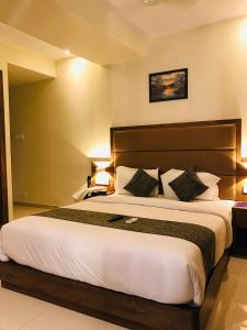 Postel nebo postele na pokoji v ubytování Hotel West Blue
