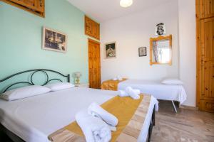 Postel nebo postele na pokoji v ubytování Apartment Evaggelia Sea View