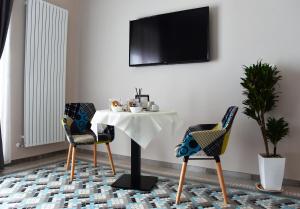 TV a/nebo společenská místnost v ubytování Casa Isabela luxury rooms
