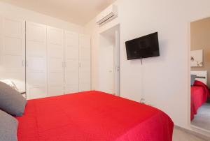 Ein Bett oder Betten in einem Zimmer der Unterkunft Ottoboni Apartment, 4 persone, balcone, Wi-Fi, Stazione Tiburtina