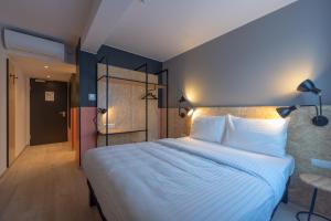 Rúm í herbergi á ibis Styles Wien Messe Prater