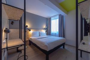 Rúm í herbergi á ibis Styles Wien Messe Prater