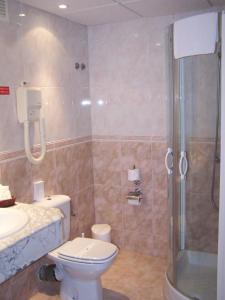 a bathroom with a shower and a toilet and a sink at Ona Princesa Playa in Marbella