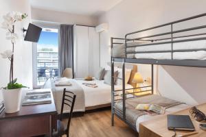Posteľ alebo postele v izbe v ubytovaní Minavra Hotel