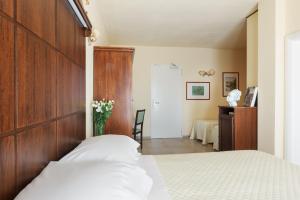 Voodi või voodid majutusasutuse Hotel Corsignano toas