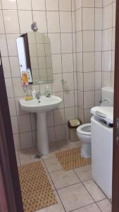 a bathroom with a sink and a toilet at Apartament Trei Stejari in Sibiu