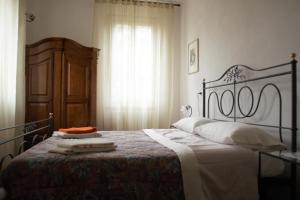 A bed or beds in a room at Villa Brizzi