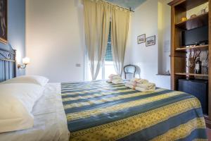 Posteľ alebo postele v izbe v ubytovaní Alla Dimora Altea