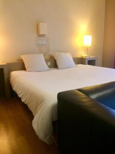 Ένα ή περισσότερα κρεβάτια σε δωμάτιο στο Hotel La Venerie
