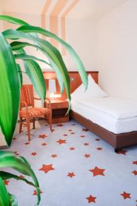 מיטה או מיטות בחדר ב-Stadthotel Stern