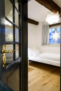 Postel nebo postele na pokoji v ubytování einzigartig - Das kleine Hotel im Wasserviertel