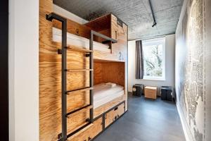 Postel nebo postele na pokoji v ubytování H.ostel Münster
