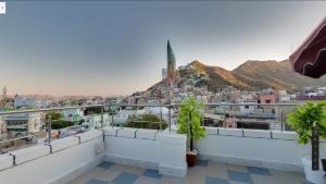 a view of the city from the balcony of a building at HOTEL MADNI ROYALE (50 Mtrs from Dargaah), Ajmer in Ajmer