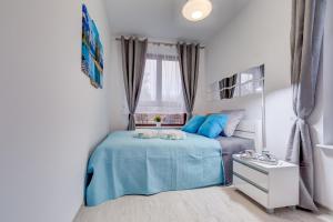 Postel nebo postele na pokoji v ubytování Apartamenty Silver