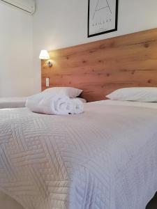 A bed or beds in a room at The Mathraki Studios