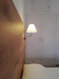 A bed or beds in a room at The Mathraki Studios