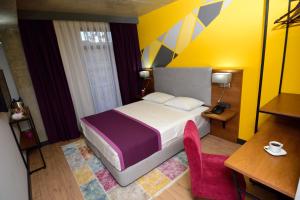 Postel nebo postele na pokoji v ubytování Hotel Adora