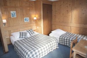 Postel nebo postele na pokoji v ubytování Hôtel Val d'Este