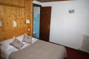 Postel nebo postele na pokoji v ubytování Hôtel Val d'Este