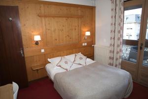 Postel nebo postele na pokoji v ubytování Hôtel Val d'Este
