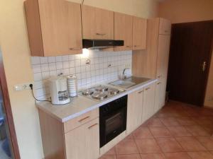 a kitchen with a sink and a stove top oven at Weingut Hirschen Enkircherweg in Burg (an der Mosel)