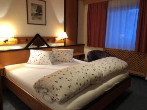 Postel nebo postele na pokoji v ubytování Hotel Garni Bergwelt