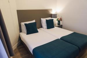 Ein Bett oder Betten in einem Zimmer der Unterkunft Hotel Corner House